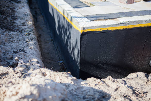 Professional Waterproofing technician working in Versailles, OH